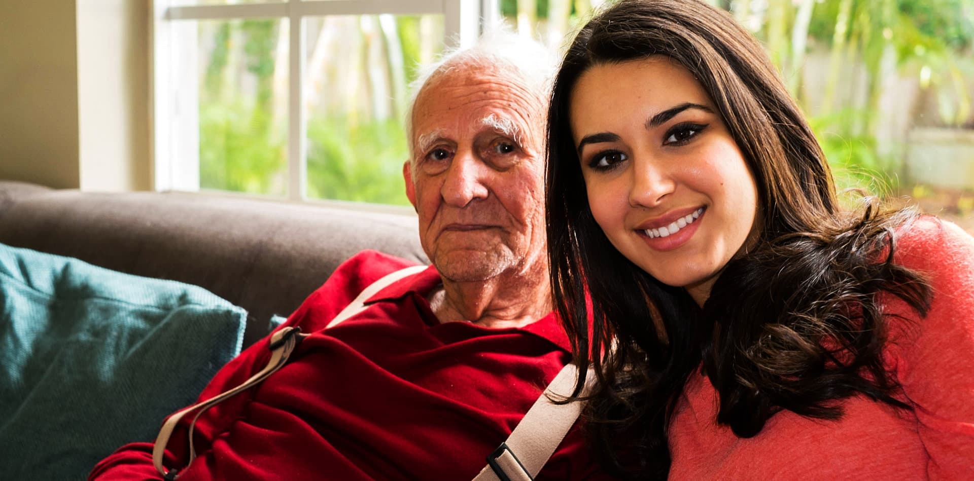 an elderly man with a beautiful woman smiling
